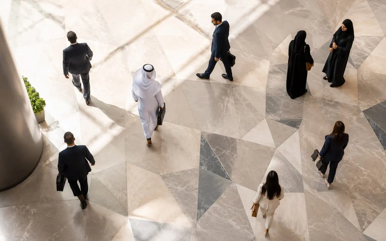 Professionals crossing a bright modern atrium